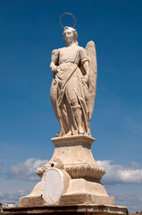 Fototapeta na wymiar San Rafael Archangel statue in the Roman bridge, Cordoba, Andalusia, Spain