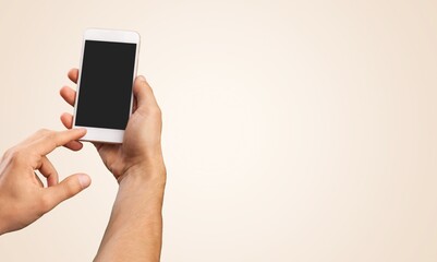 Hand holds a phone with phone with a blank screen