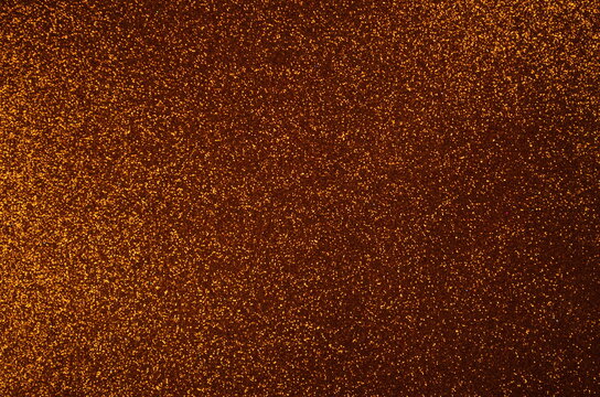 bronze shining glitter background. party concept. shimmering surface. New year, birthday. glowing background