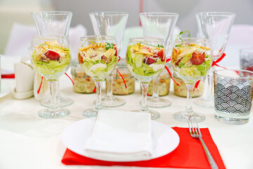 original serving of portioned salads on the table. catering.