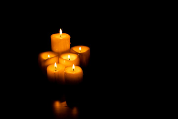 Set of candles on a black background with copy space. Holy Week, Good Friday, Pentecost, Religiosity and spirituality