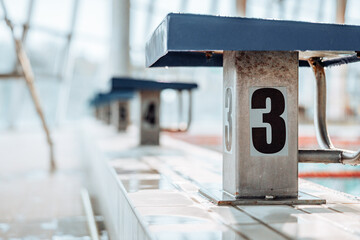 Swimming-Pool with equipment and large windows with a view outside