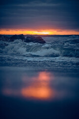 Obraz premium Waves at the danish shore at late sunset. High quality photo