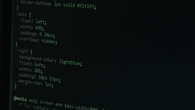 Close Up Code Screen with Different Colours and Cursor Navigating Website with Pixel Details HTML - Focus Pull Footage