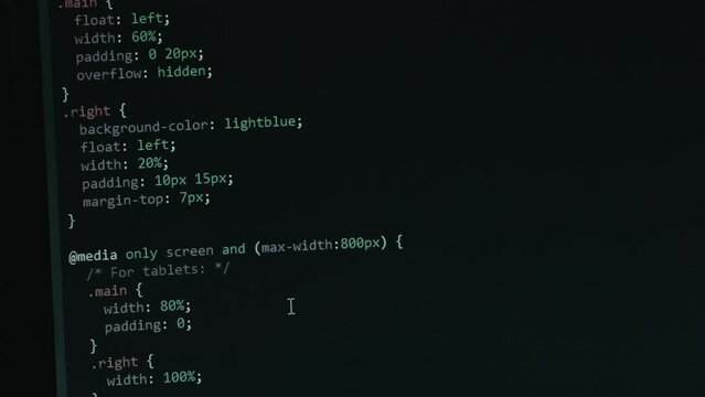 Close Up Code Screen with Different Colours Navigating Upwards with Pixel Details HTML