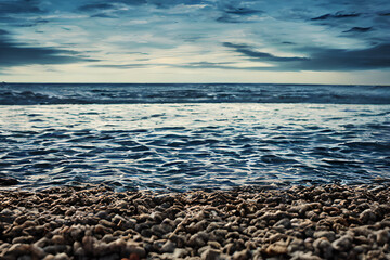 Seascape abstract beach background. blur bokeh light of calm sea and sky. Focus on sand foreground ai generative