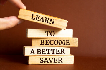 Wooden blocks with words 'Learn to Become a Better Saver'.