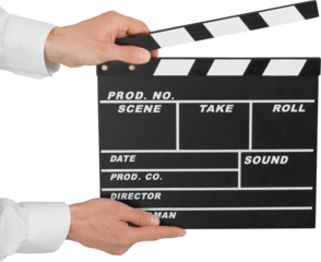 Human hand holds movie clapper board