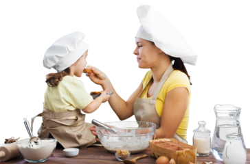 The beautiful young mother and her little daughter cooking