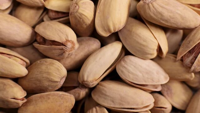 Salted pistachios, beer snack rotate, close-up