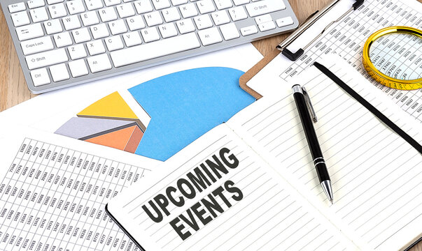 UPCOMING EVENTS text on a paper on chart background