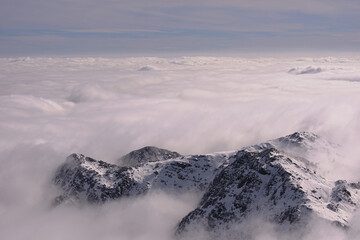 Peaks and rocks above the sea of clouds. Bergamo Alps ( Orobie ), Italy