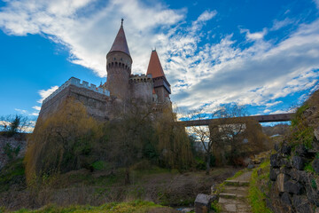 Fototapeta na wymiar The Corvin or Hunyadi castle (Castelul Corvinilor or Huniazilor) is a Gothic-Renaissance castle with wooden bridge in Transylvania, Romania, one of the largest in Europe. Traveling concept background