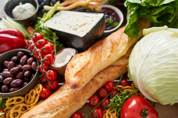 Baguette. Fresh bread, pastries. Table full of mediterranean appetizers, tapas or antipasto. Assorted Italian food set. Delicious snack on party or picnic time. Italian style banquet. 