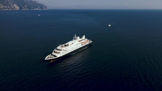 Aerial view of cruise boat sailing in Amalfi, Salerno, Campania, Italy.