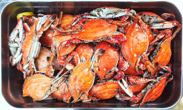 Full bowl of boiled crabs, top view.
