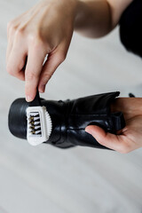 Hands cleaning women's  shoe