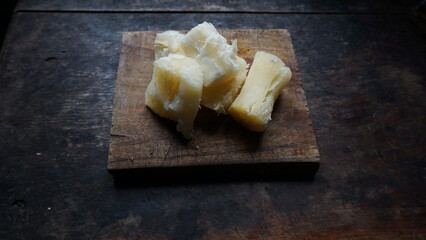 Selective photo of boiled cassava on a wooden tray. Replacement carbohydrates of rice. alternative food to replace rice.