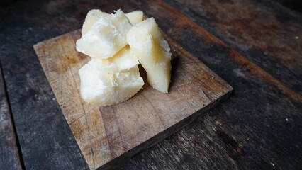 Selective photo of boiled cassava on a wooden tray. Replacement carbohydrates of rice. alternative food to replace rice.