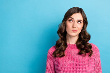 Fototapeta premium Photo of minded pretty lovely lady wear stylish pink clothes interested look empty space banner poster isolated on blue color background