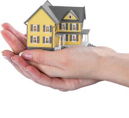 hand holding a miniature house model