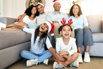 Christmas, smile and portrait of big family on sofa in home living room, bonding and laughing at...