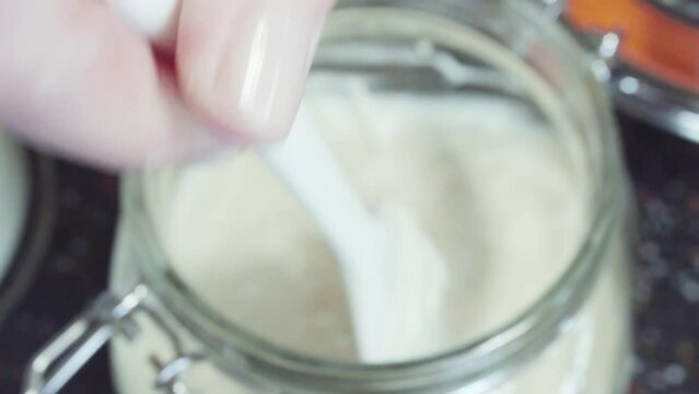 Time lapse. Preparing homemade sourdough starter for baking bread.