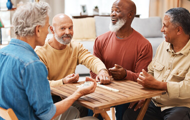 Senior men, friends and dominoes in board games on wooden table for activity, social bonding or...