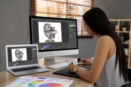 Animator working with graphic tablet, computer and laptop. Illustrations on screens