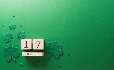 Happy St Patrick's Day decoration concept made from shamrocks ( clover leaf), wooden calendar and...
