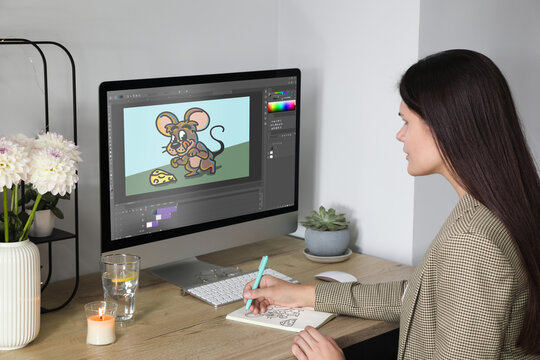 Animator working at table. Modern computer with illustration on screen