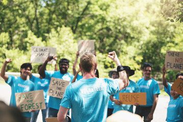 Caucasian man main vocal of environment volunteer group talking with volunteer organization for save the planet campaign in public park area.
