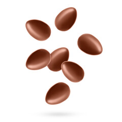 Many chocolate eggs falling on white background