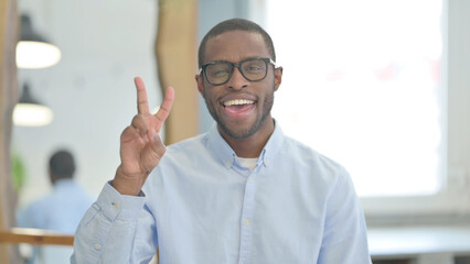 Portrait of African Man with Victory Sign