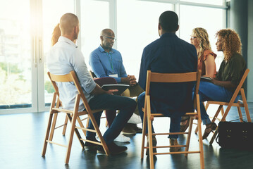 Fototapeta premium We aim to do something creative everyday. Shot of a group of diverse creative employees having a meeting inside.