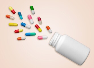 Set of medical pills in bottle on the desk