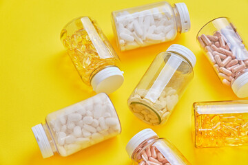 Supplement Bottle on Yellow Background