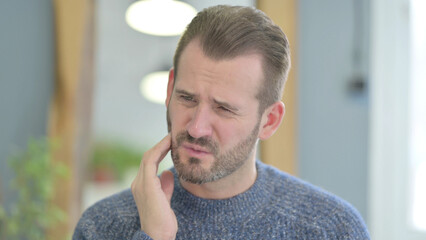 Portrait of Middle Aged Man with Toothache