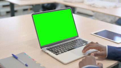Young African Businessman Working on Laptop with Chroma Key Green Screen