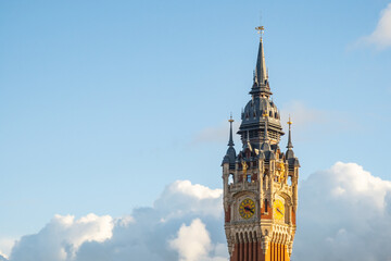 Fototapeta na wymiar Belfry, clock tower at town hall in Calais, France