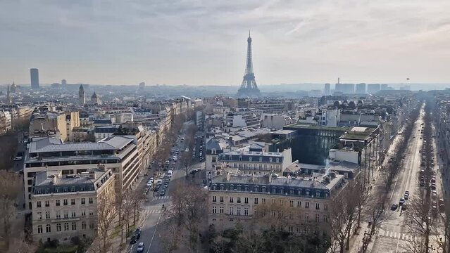 Aerial Paris cityscape with view to the Eiffel Tower, France. Beautiful parisian architecture with historic buildings, landmarks and busy city streets
