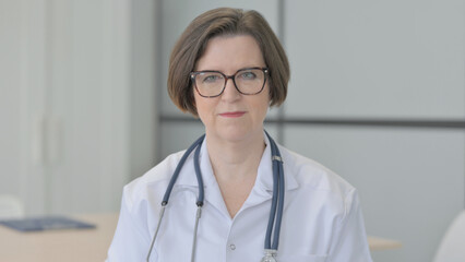 Portrait of Serious Senior Female Doctor