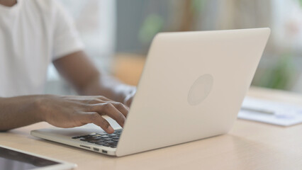 African Man Typing on Laptop, Close up