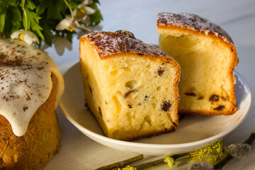 Easter cake in the sunlight. Pieces of Easter cake on a plate. Easter.