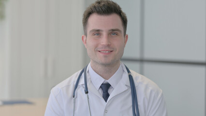 Portrait of Young Doctor Shaking Head in Approval