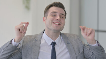Portrait of Dancing Young Businessman Feeling Amazed