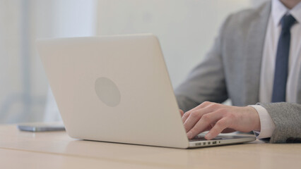 Close up of Male Hands Typing on Laptop