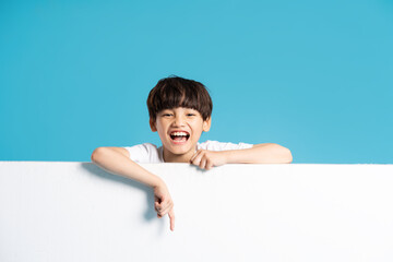 Asian boy portrait on blue background