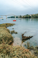 Betanzos estuary landscape in Bergondo. In the background the Period Bridge in foreground an old shipwreck