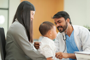 A kind doctor who treats pediatric patients. The child and his family brought him to see the doctor at the hospital because he was ill.